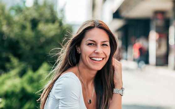 woman smiling with dental bridges in Rockville
